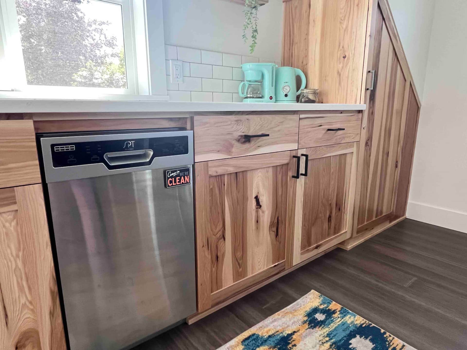 Kitchen with warm wood cabinets and full appliances