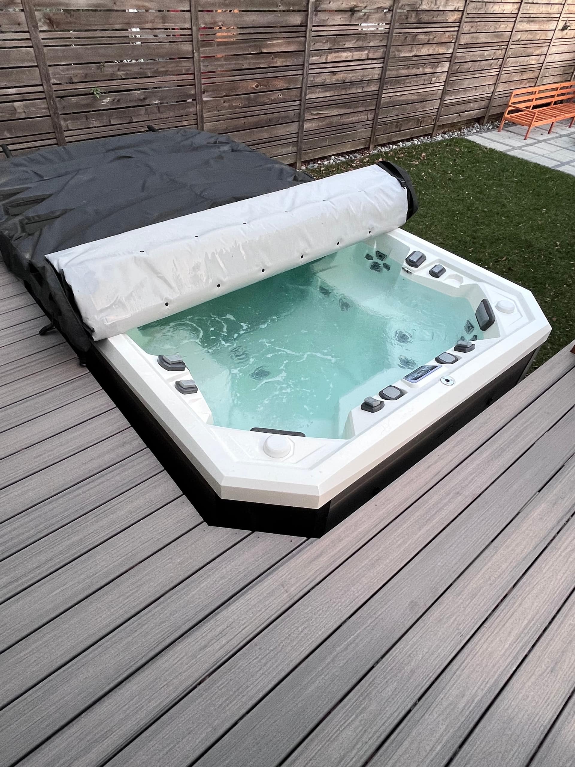 The swim spa with clear turquoise water in daylight